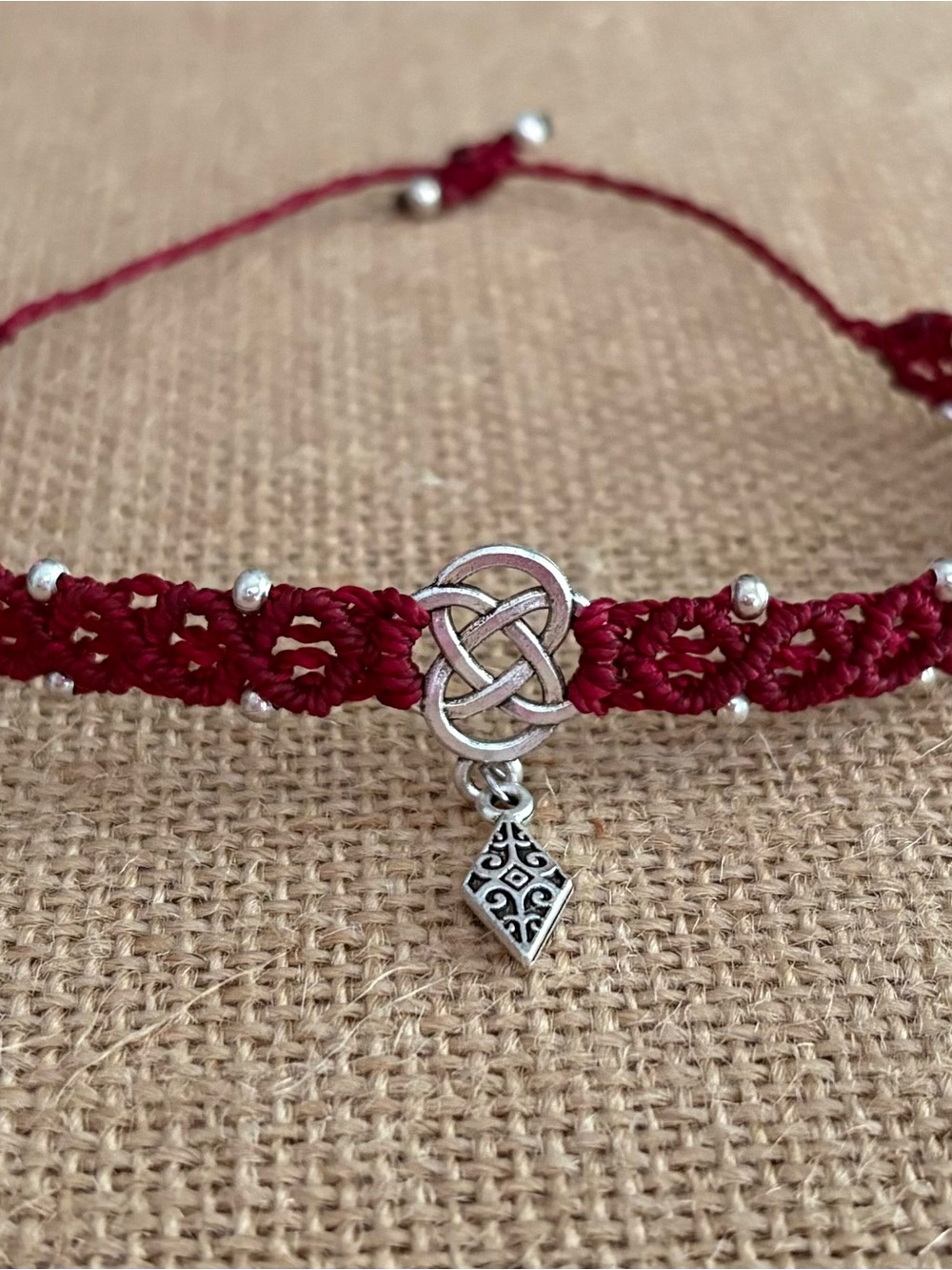 Adjustable Red Macramé Bracelet with Silver Celtic Knot Accent. Foot Bracelet